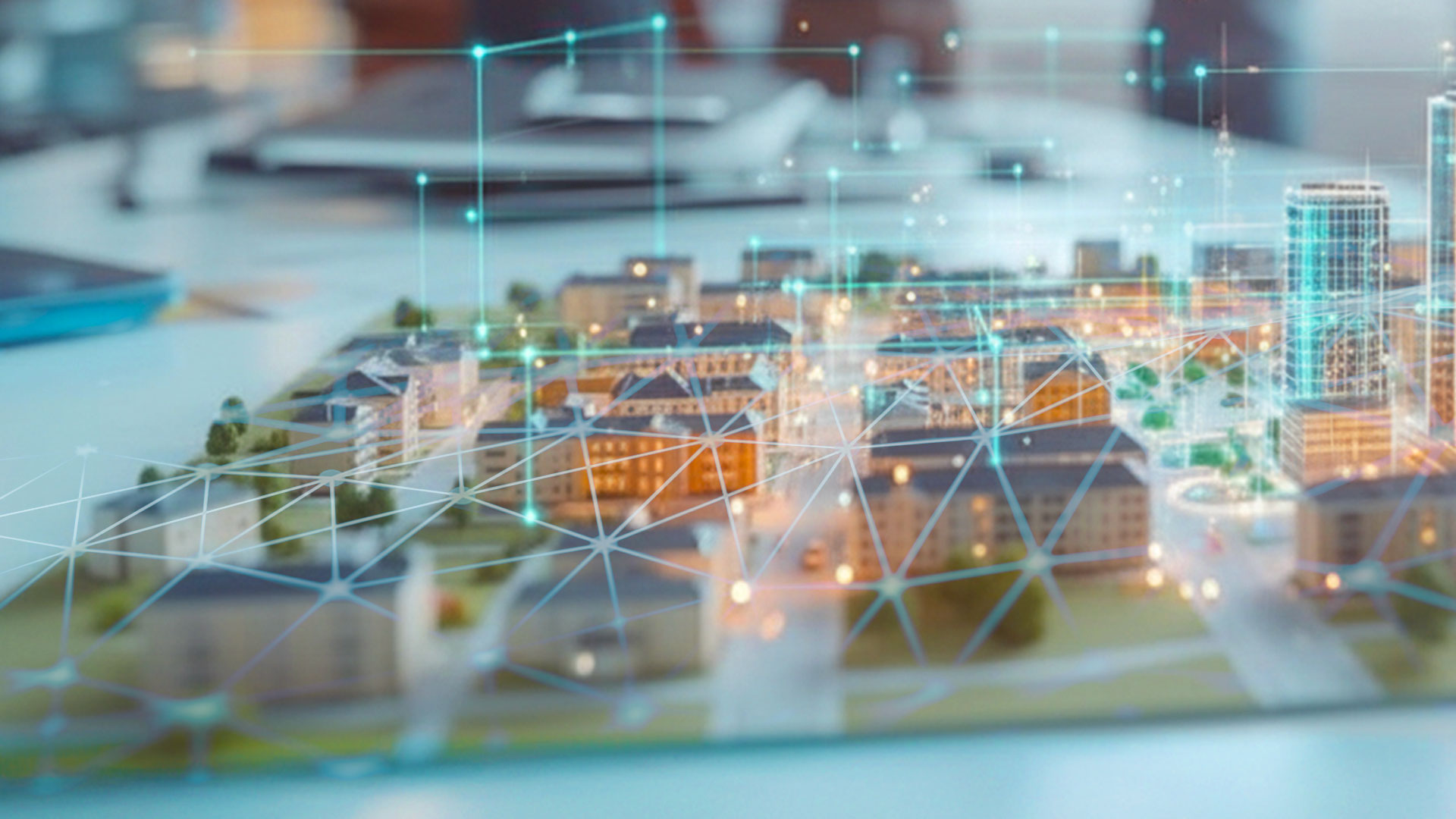 Ausschnitt einer Visualisierung einer fiktiven Büro-Szene mit virtuellem Stadtmodell im Vordergrund